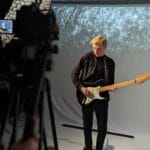 Using a projector as a background during a music video shoot in the studio.